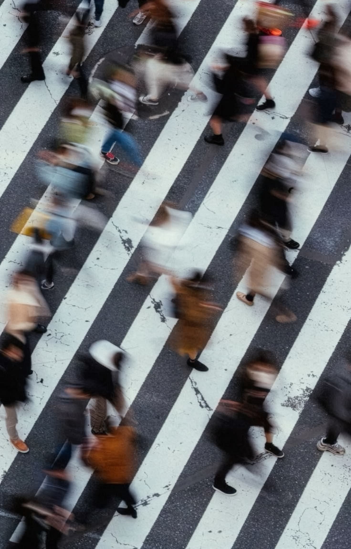 People crossing a city crosswalk